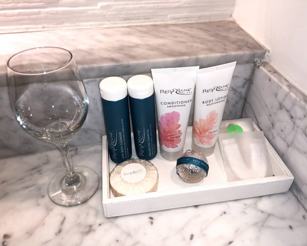 In Room Toiletries at Sandals with Drinking Glass for Size Reference